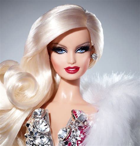 A Close Up Of A Barbie Doll With Blonde Hair And Bright Blue Eyeliners