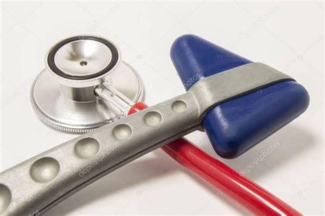 Red Stethoscope And Neurological Reflex Hammer With Blue Triangular