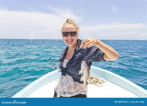 Woman Holding Up A Fish That She Caught Stock Image Image Of Boat