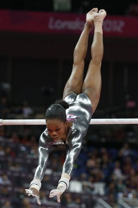 Us Gymnast Gabby Douglas Performs During The Womens Uneven Bars Of The