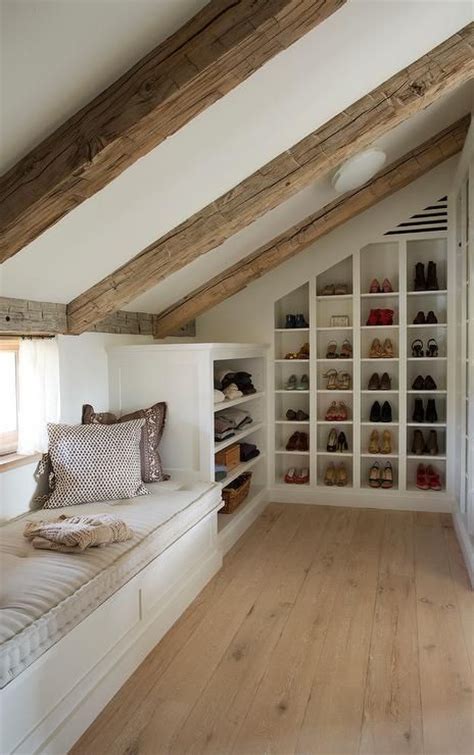Walk In Attic Closet Features A Sloped Ceiling Lined With