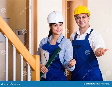 Professional Maintenance Crew Of Two Specialists Indoors Stock Photo