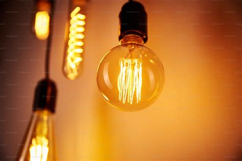 Set Of Vintage Light Bulb On Orange Background Soft Focus Glowing