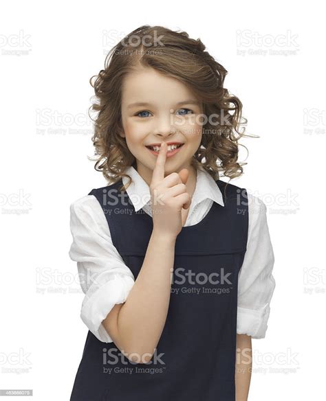 Preteen Girl Showing Hush Gesture Stock Photo Download Image Now