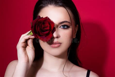 Brunette Woman With Blue Eyes And Red Rose Beautiful Girl With Reses