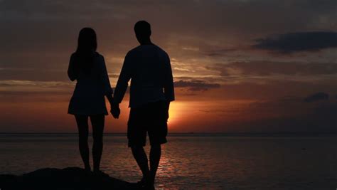 couple silhouette at the beach sunset light stock footage video 3600287 shutterstock