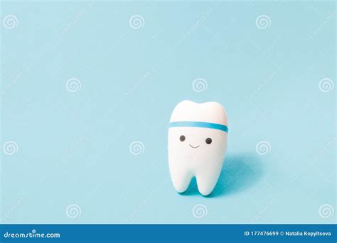 Happy Tooth On A Blue Background Copy Space Oral Care Concept Toy