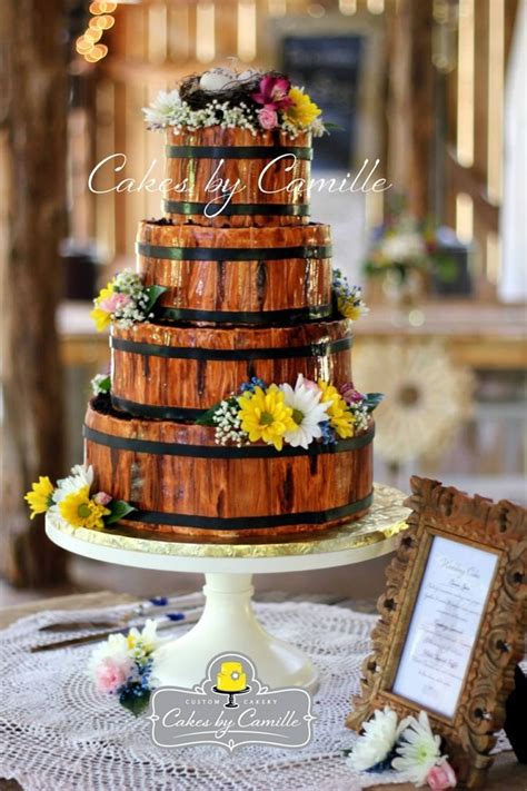 A cake designed as a castle and a stunning wedding cake! Rustic wooden barrel wedding cake, Cakes by Camille, LLC ...