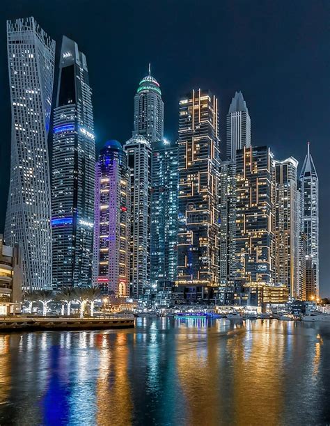 View Of The Dubai Marina Skyline And Highrise Towers At Night Stock