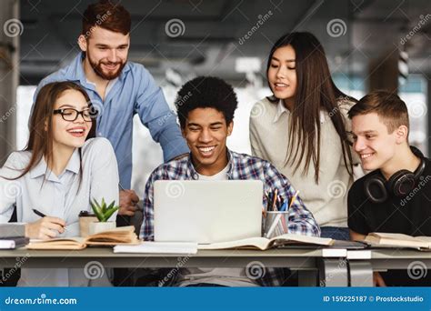 University Students Doing Group Project In Library Stock Image Image
