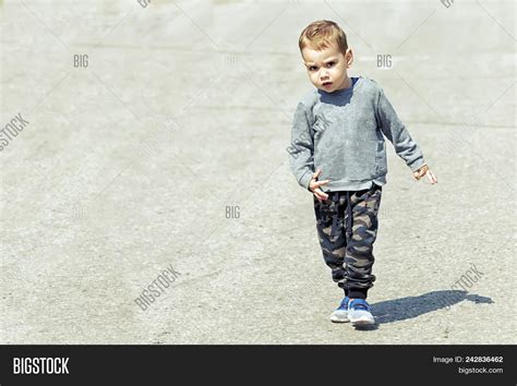Little Boy Walks Along Image And Photo Free Trial Bigstock