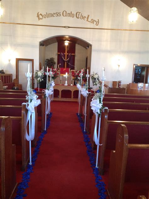 Candelabras Attach To Pews And Silk Petals Line The Aisle Ceremony