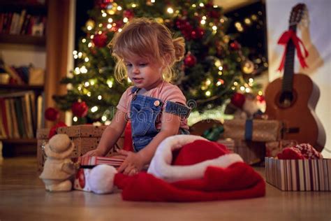 Child Girl Opening Ts Girl Opening Christmas T At Home Stock