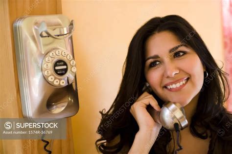 Woman Talking On The Telephone Superstock