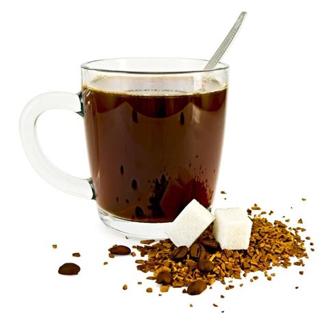 Premium Photo Coffee In A Glass Mug A Spoon Grains And Granules Of Coffee On A Table With