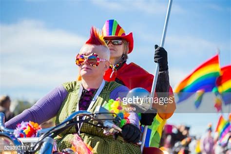 Couple Riding Bike During Gay Pride Parade Photo Getty Images