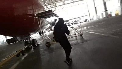 A Group Have Recorded Themselves Entering An Airport Hangar And On A