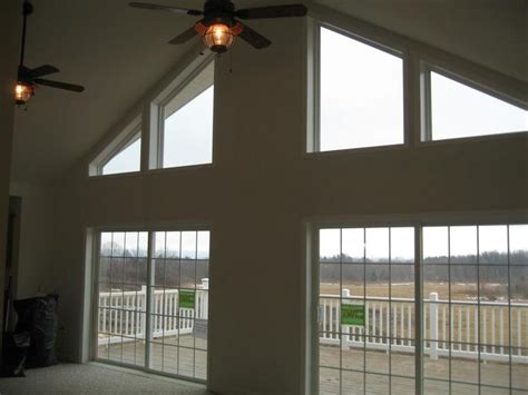 Vaulted ceilings bring a sense of openness to a home. 7/12 vaulted ceiling with trapezoid windows | Dining room ...