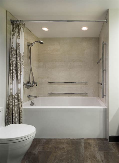 Check Out This Deep Soaking Tub Equipped With A Mounted Handheld Shower Head And Long Grab