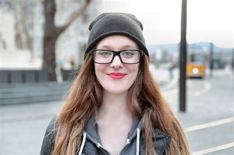 Closeup Shot Of A Girl With Red Lipstick Glasses And A Black Beanie