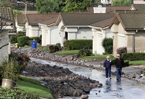 Husband And Wife Rescued From Floods After Mudslides On West Coast