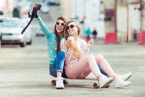 Hipster Girlfriends Taking A Selfie In Urban City Context Concept Of