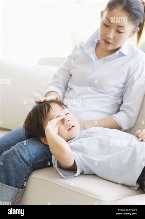 Boy Lying In Mother S Lap Stock Photo Alamy