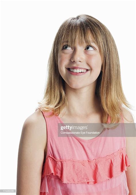 Smiling Girl Looking Up High Res Stock Photo Getty Images