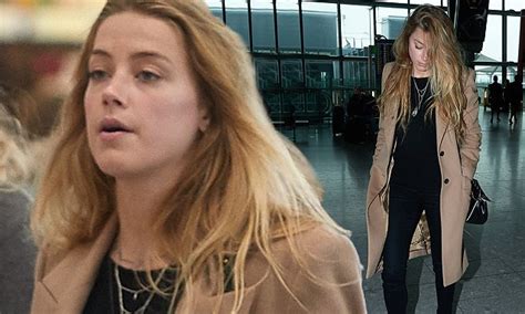 Amber Heard Goes Make Up Free As She Jets Out Of London After Filming