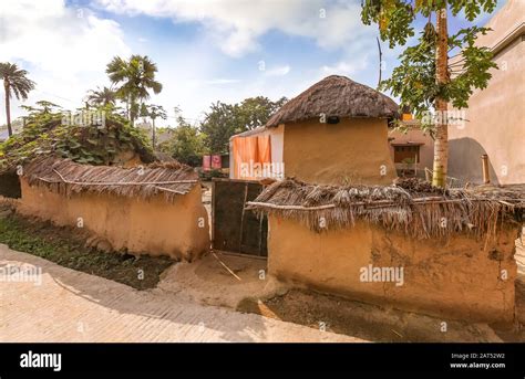 Rural Indian Village With View Of Mud Hut With Thatched Roof At Bolpur
