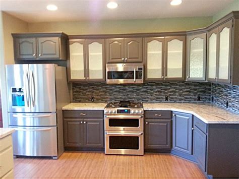 And, some cabinet painters may charge extra if they have to remove the doors to paint them. Cabinets With A View - Jennifer Davis