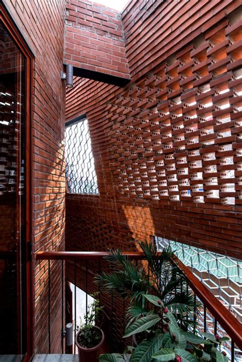 Handp Architects Wraps Perforated Brick Walls Around Brick Cave House