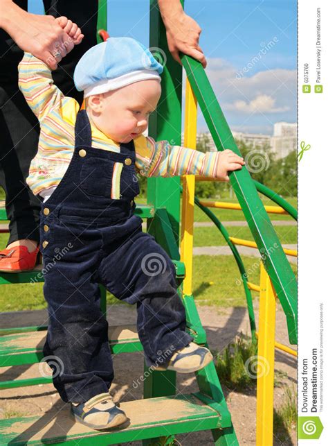 Mother Learns Child To Walk Along Stairs Stock Photo Image Of Playful