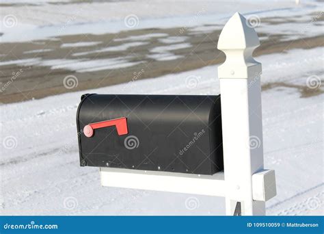 A Mailbox Overlooks A Snow Covered Roadway Stock Image Image Of