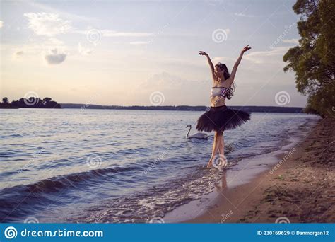 Vulnerable And Sensual Japanese Ballet Dancer In Black Tutu Posing Near