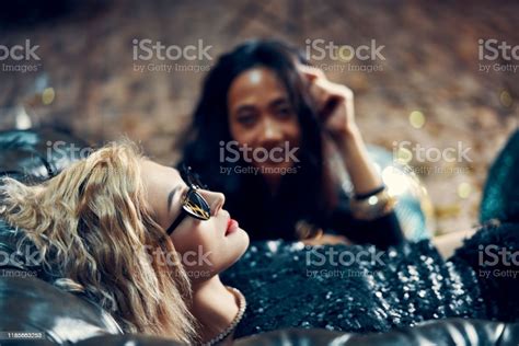 Pretty Young Woman Relax And Lying On Sofa After Crazy Party Stock