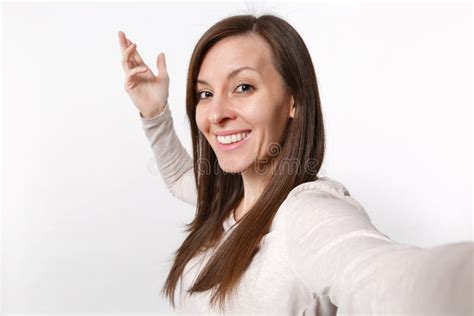 Close Up Selfie Shot Of Smiling Attractive Young Woman In Light Clothes