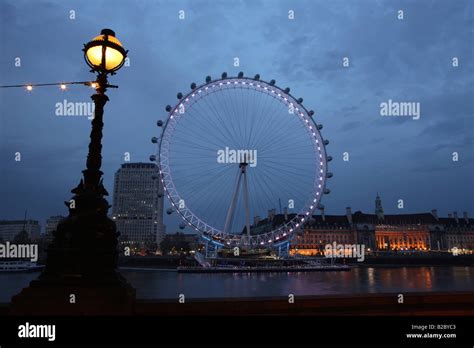 London Eye Ferris Wheel On The Banks Of The Thames River London