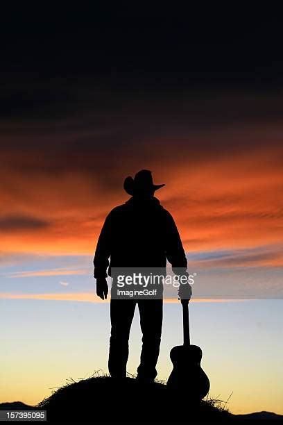 Cowboy Guitar Silhouette Photos And Premium High Res Pictures Getty