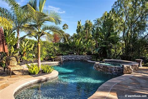 Tropical Swimming Pool With Raised Beds Fence Exterior Stone Floors