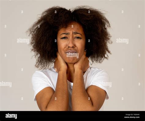 Portrait Of African American Woman In Pain With Sad And Exhausted Face