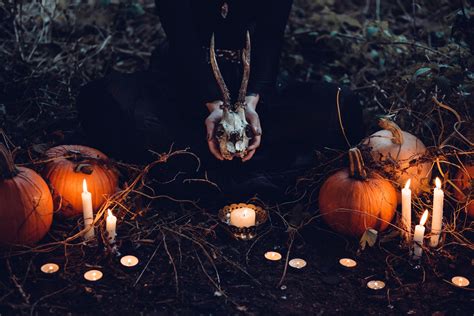 Wallpaper Id 256026 A Woman Holding A Skull With Horns Close To