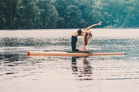 Why Stand Up Paddle Board Yoga Is The Best Summer Workout Paddle