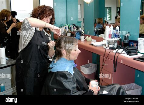 Woman Has Hair Cut Shampoo Color And Permanent Done By A Beautician At