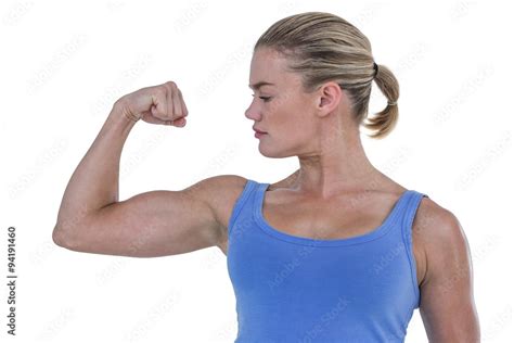 Muscular Woman Flexing Her Muscle Stock Photo Adobe Stock