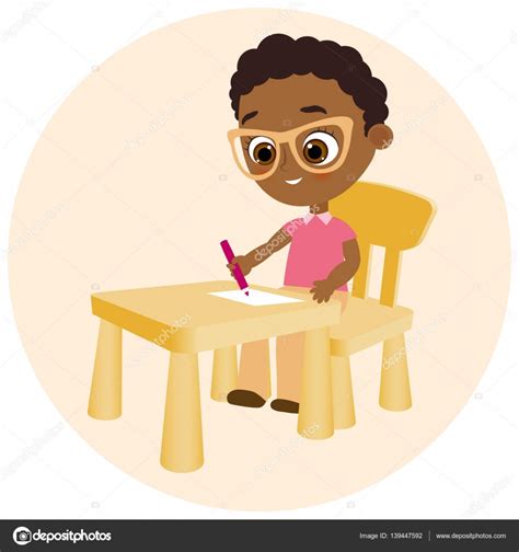 Young African American Boy Paints Sitting At A School Desk