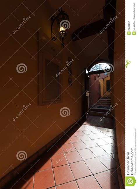 Interior View From Hallway Through Open Door To Courtyard Of An Stock