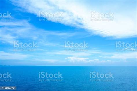 Calm Sea Ocean And Light Blue Sky Background Stock Photo Download