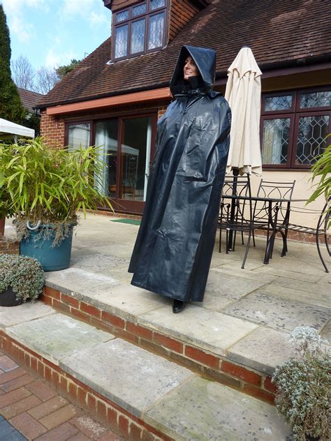 A Dramatic And Effective Waterproof Cape In Shiny Black Surfaced Proofed Cotton Similar