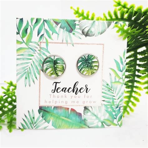 A Card With Some Green Leaves And The Words Teacher Thank You For